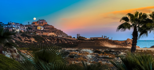Fototapeta na wymiar Sunset and Moonrise on the Villas, Cabo San Lucas, Baja California, Mexico