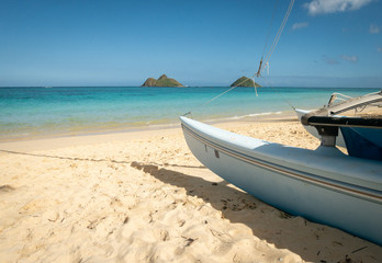 Sailing boat parked on tropical sandy beach with azure waters, shot at Kailua Beach, Oahu, Hawaii,...
