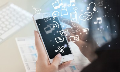 Social media interactions and mobile phone in human hands