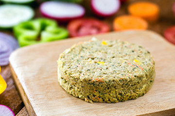 closeup of roasted vegetarian hamburger, dessert or meatless snack. Home made with vegetables, chickpeas, soy and proteins. Vegetarian life and vegetarian meal concept.