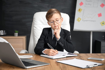 Little secretary working in office