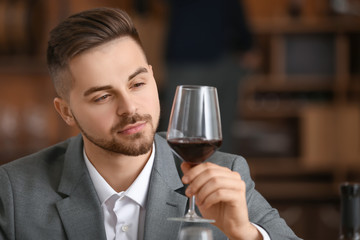 Man tasting wine at the restaurant