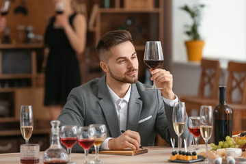 Man tasting wine at the restaurant