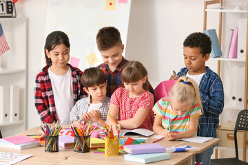 Little children during lesson at language school