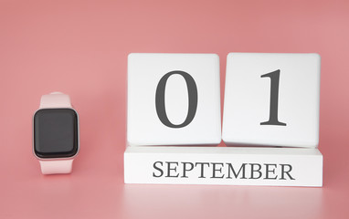 Modern Watch with cube calendar and date 01 september on pink background. Concept autumn time vacation.