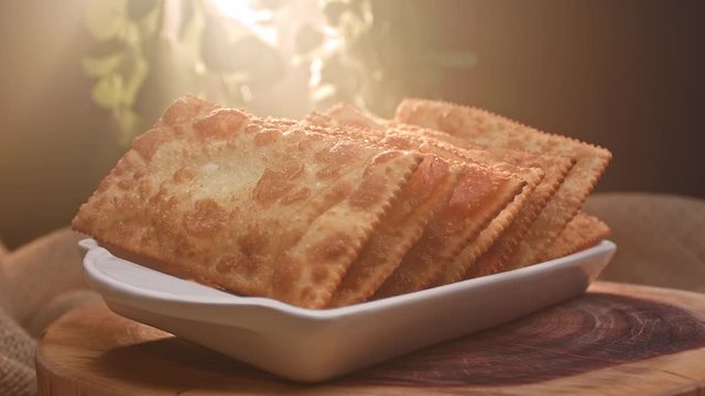 Fried pastry on a plate with different flavors