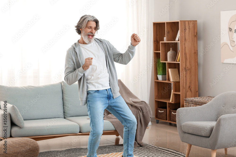 Canvas Prints Cool senior man dancing at home