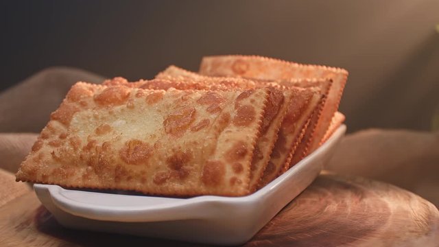 Fried pastry on a plate with different flavors