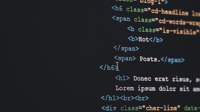 4K Close up shot HTML tag code on PC Monitor. Background concept for programming and coding web development.