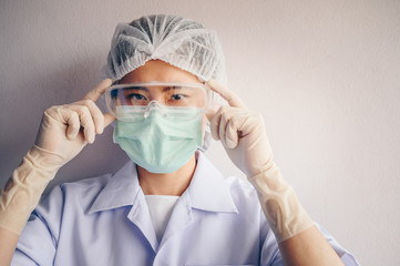 Healthcare worker wearing medical equipment for working in hospital during Covid-19 pandemic. Conceptual of healthcare and medical condition, New normal lifestyle.