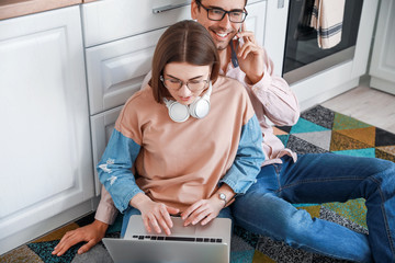 Young couple working together at home