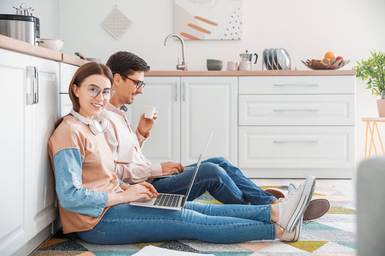 Young couple working together at home - Powered by Adobe
