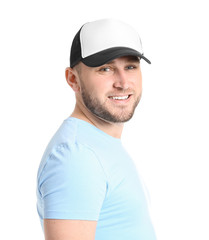 Handsome man in stylish cap on white background