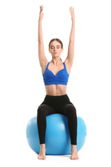 Fototapeta premium physical wellness and fitness training, woman practicing yoga on a stability ball