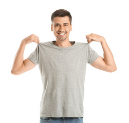 Man in stylish t-shirt on white background