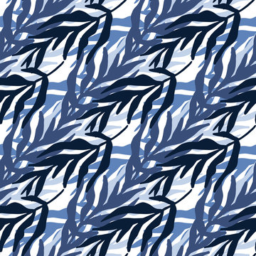 Abstract jungle plants leaves seamless pattern in blue colors. Trendy tropical leaf wallpaper. © smth.design