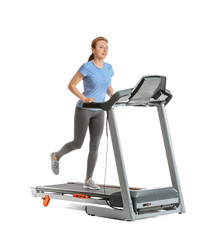 Sporty woman training on treadmill against white background