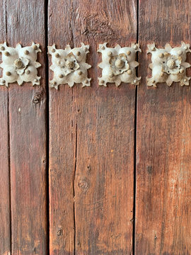 old wooden door with iron decoration