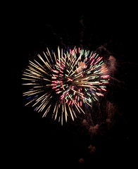 Fototapeta premium Explosive colorful fireworks display celebrating the fourth of July holiday leaving room for copy..