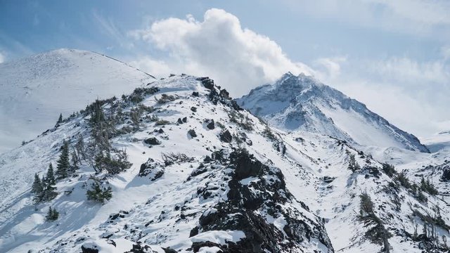 Timelapse of Clouds Rolling Off North Sister Mountain in Snow on Sunny Day in Three Sisters Wilderness, Oregon