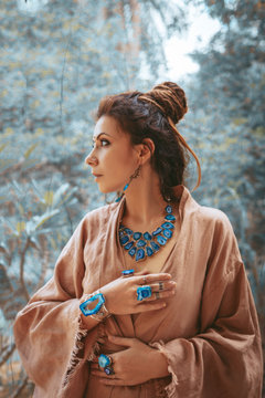 beautiful young woman with gem stones accessories outdoors portrait