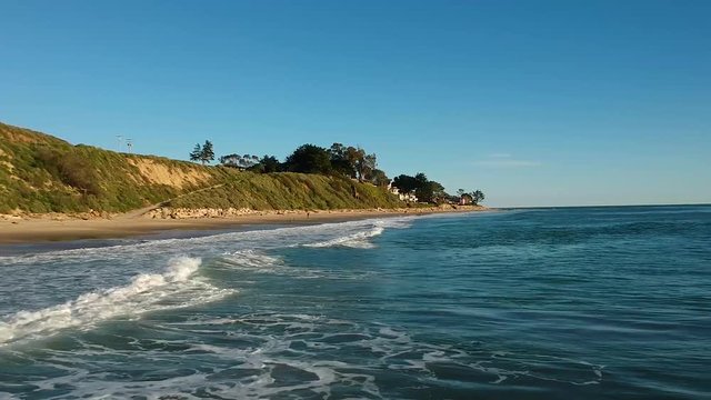 Close Up Aerial Tracking Shot of Ocean Waves at Rincon Beach Park, California