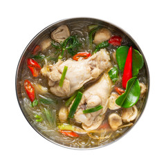 Homemade chicken and vegetable soup with glass noodles In the cup isolated on white background. Spicy ingredients thai food.