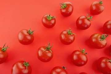Tomato pattern. Tomato background. Red ripe tomatoes on a  red background. Tomatoes season vegetables. Farm organic  vegetables