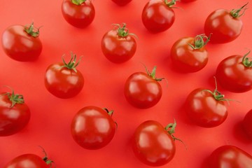 Tomato pattern. Tomato background. Red ripe tomatoes on a bright red background. Tomatoes season vegetables.  organic bio vegetables
