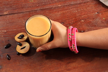 Ripe fresh whole and half of sapota fruit isolated on white background, Indian Chikoo

