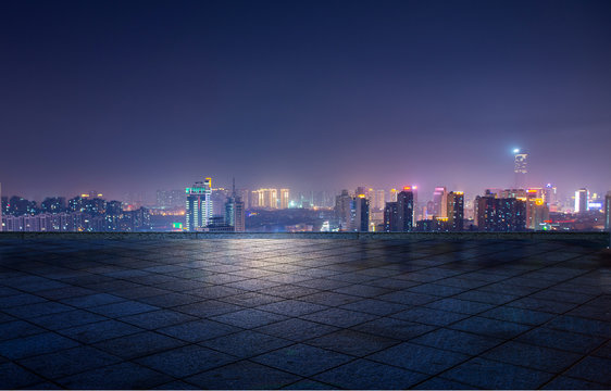 Fototapeta Night view of city lights in front of marble square, Xuzhou, China