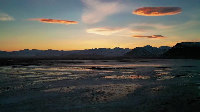 Majestic Sunset With Polar Stratospheric Clouds, Nacreous Clouds Over Vatnajokull Glacier Cap In South Iceland. - aerial drone shot