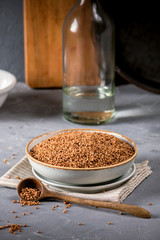 Fresh buckwheat seeds on grey background