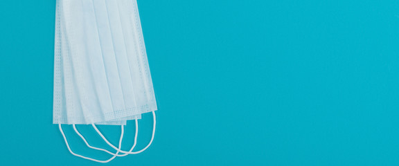 Medical mask protective virus, flu, disease. Isolated on a blue background.
