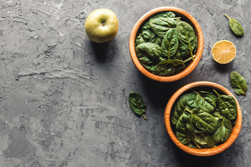 Green food background on stone table top view. Healthy food, vegan, eco products.