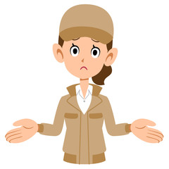 呆れるベージュ色の作業着を着た女性の上半身
