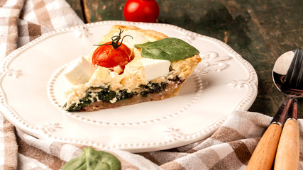 Homemade spinach french pie quiche lorraine. Delicious breakfast or snack. Food recipe background