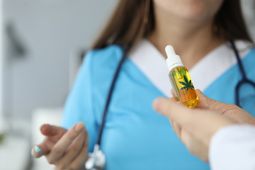 Doctor holding bottle with cbd