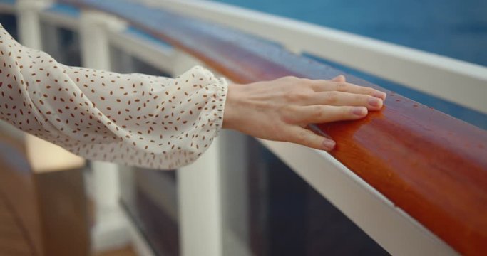 Female hand on the railing of the ship. Shot on Black Magic Cinema Camera
