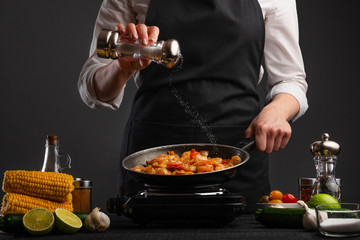 Chef cook fries noodles with shrimp and vegetables. Cooking food
