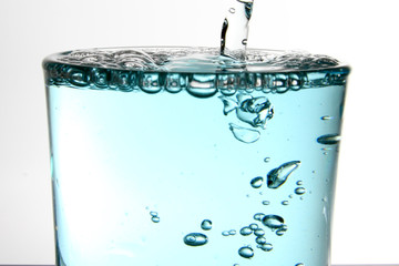 Fototapeta na wymiar Oral mouthwash in transparent glass