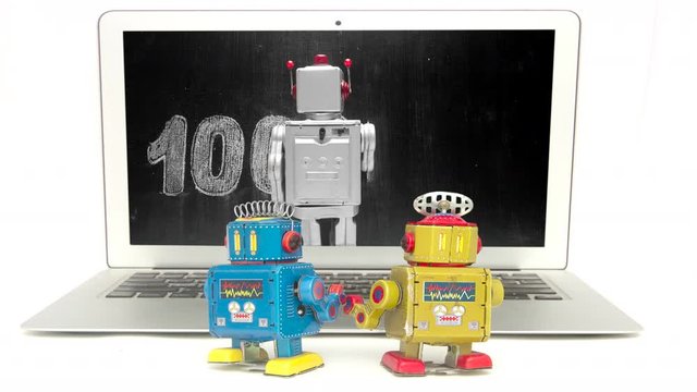 Two little bots learn about binary code 