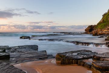 High tide wave water overflowing at Turimetta Beach, Sydney, Australia.