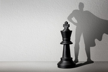 Chessman with shadow.The battle of competition and strategy ideas with market mechanism.Creative...