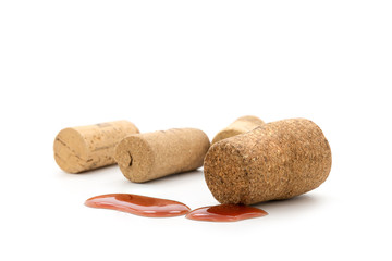 Wine corks with drop red on white background.
