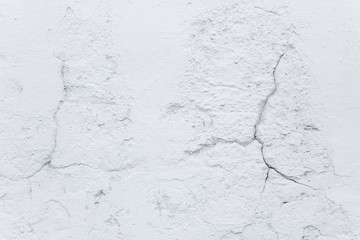 Texture and background. Crack in the white old concrete wall. Repair and construction