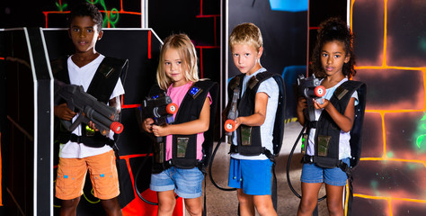 Group of tweenagers with laser guns