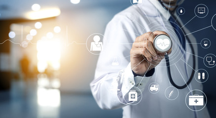 Medicine doctor holding stethoscope in hospital