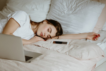 Woman fallen asleep while using computer.
