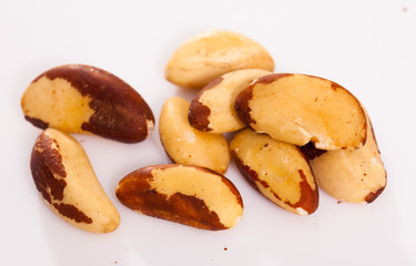 Brazilian nut scattered on white surface